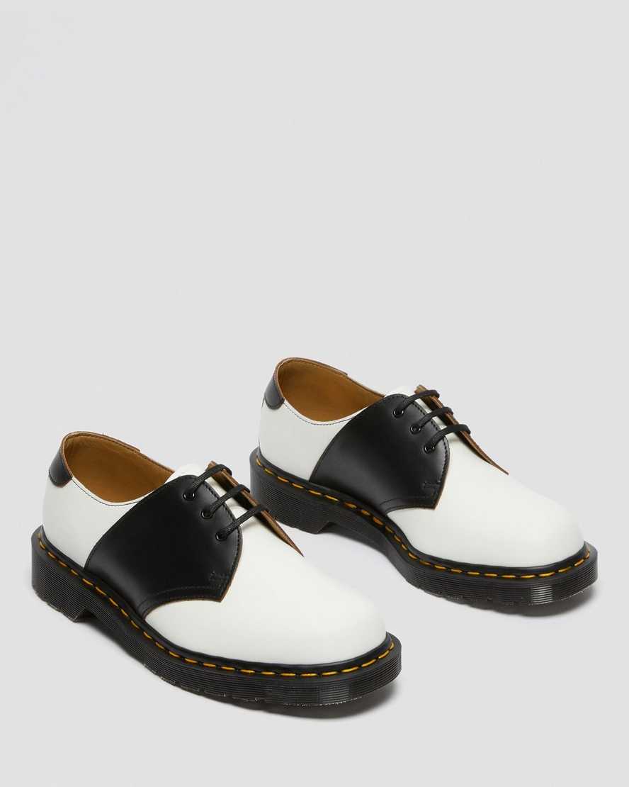 weiße und schwarze dr. martens 1461 herren-sattelschuhe