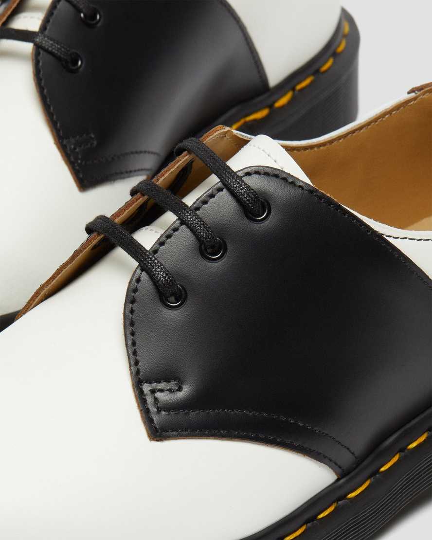 weiße und schwarze dr. martens 1461 herren-sattelschuhe