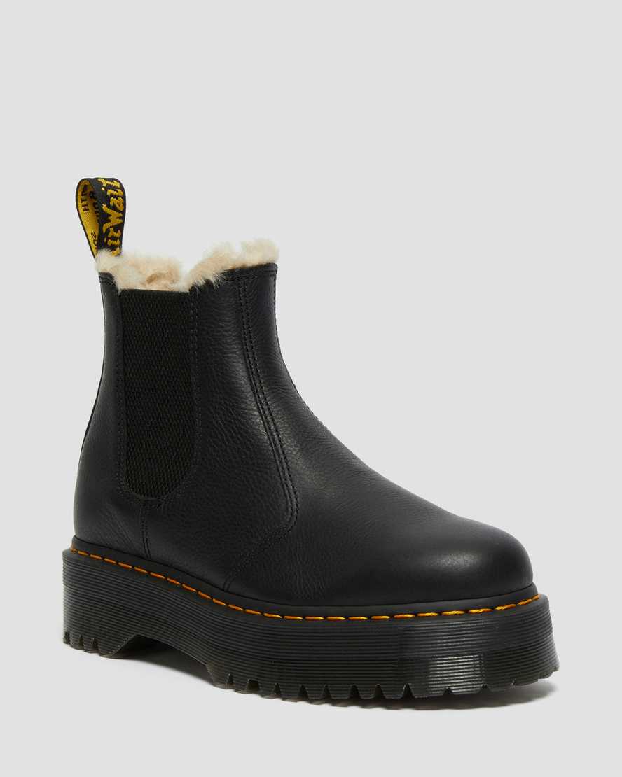schwarze dr. martens 2976 chelsea boots mit kunstfellfutter und plateausohle für damen.