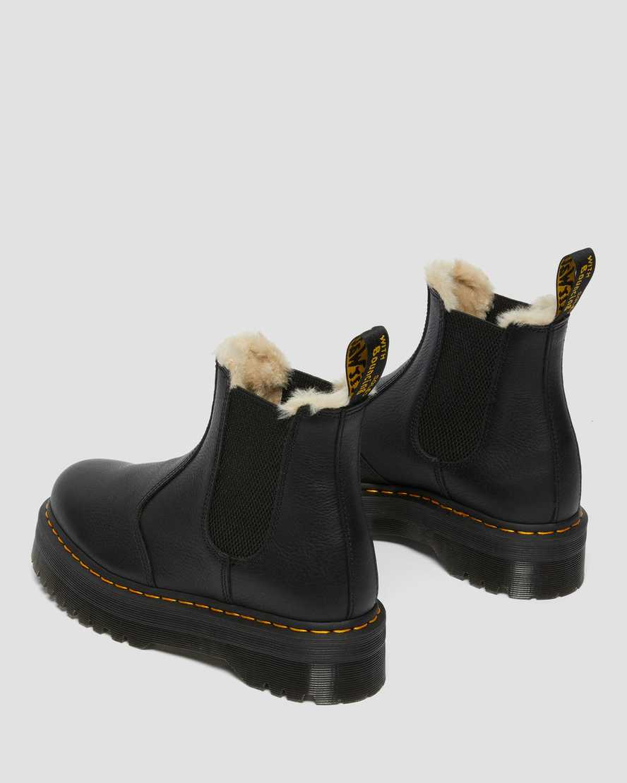 schwarze dr. martens 2976 chelsea boots mit kunstfellfutter und plateausohle für damen.