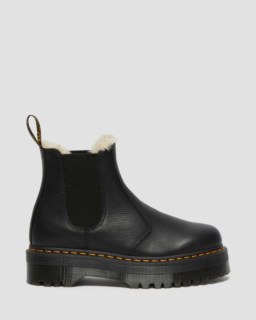 schwarze dr. martens 2976 chelsea boots mit kunstfellfutter und plateausohle für damen.