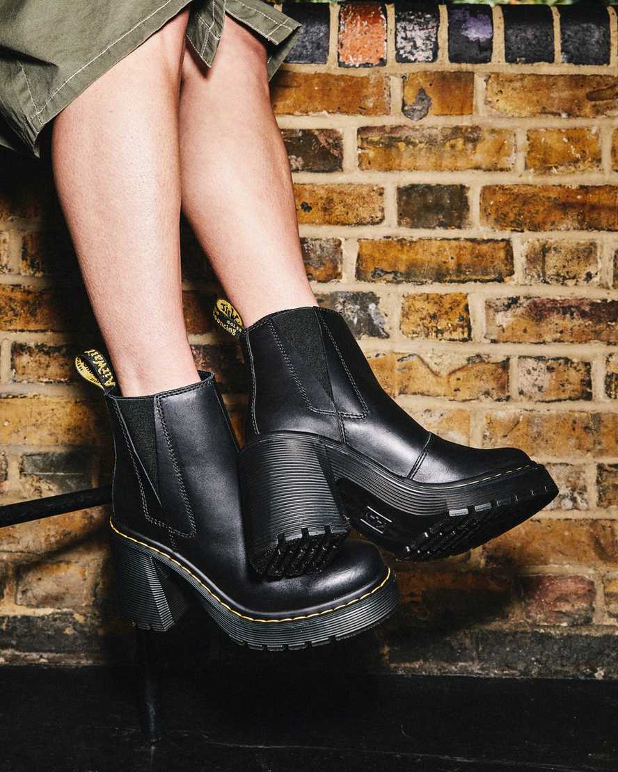 schwarze dr. martens spence chelsea boots mit ausgestelltem absatz für damen