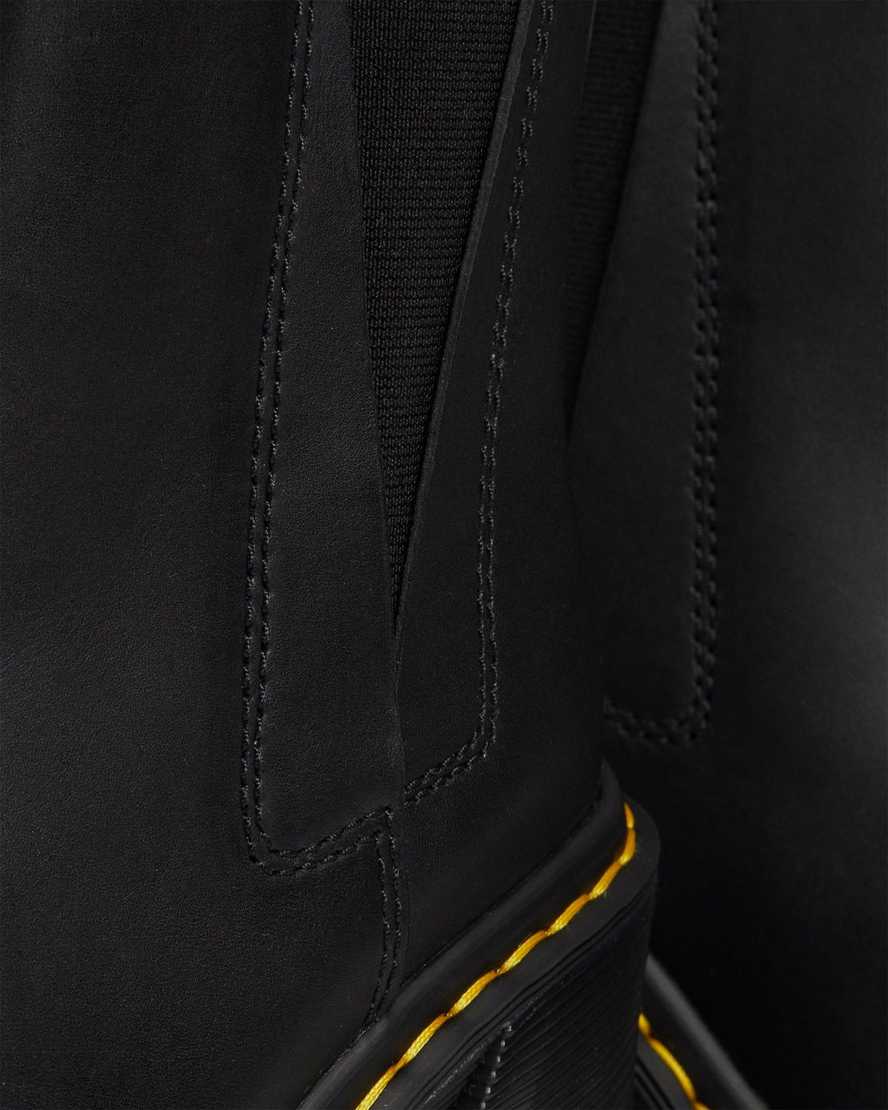 schwarze dr. martens spence chelsea boots mit ausgestelltem absatz für damen