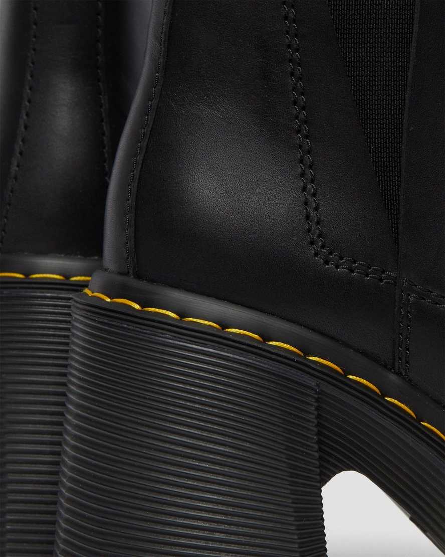 schwarze dr. martens spence chelsea boots mit ausgestelltem absatz für damen