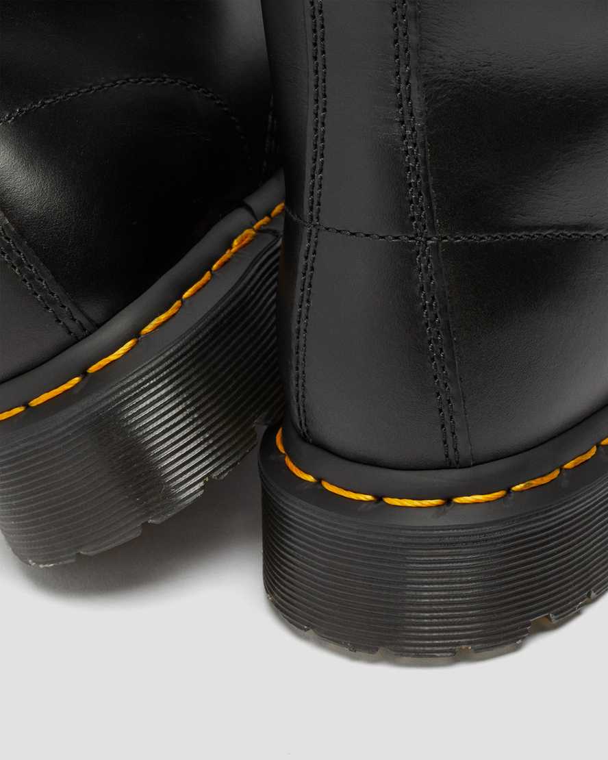schwarze dr. martens 1460 serena schnürstiefel für damen mit kunstfellfutter.