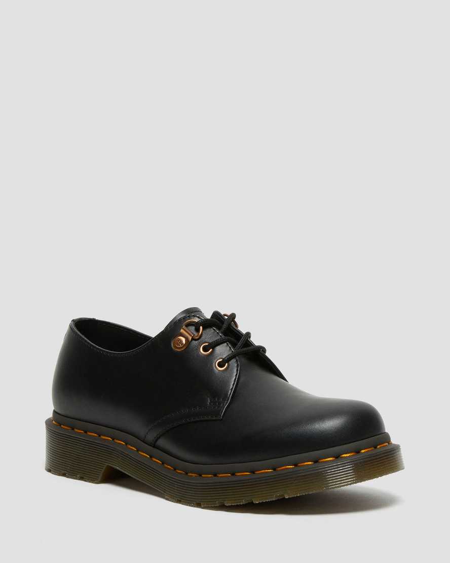schwarze dr. martens 1461 damen-freizeitschuhe mit roségoldenen beschlägen