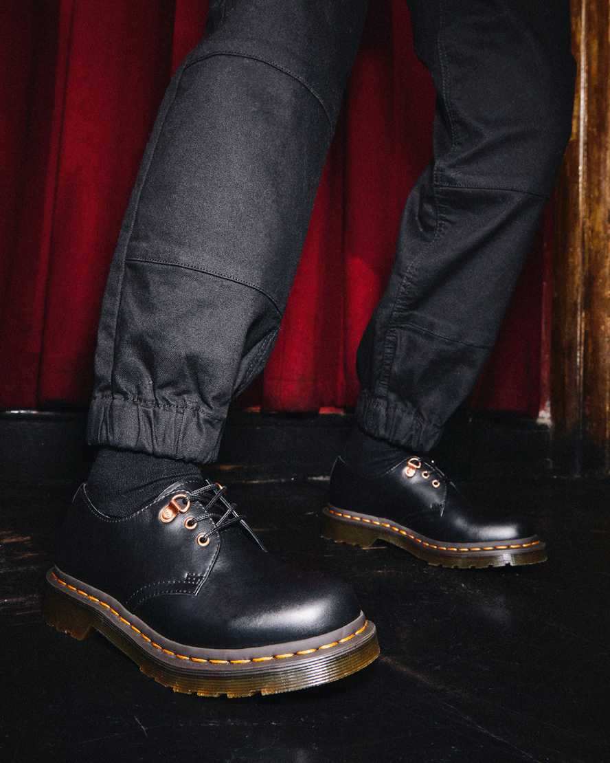 schwarze dr. martens 1461 damen-freizeitschuhe mit roségoldenen beschlägen