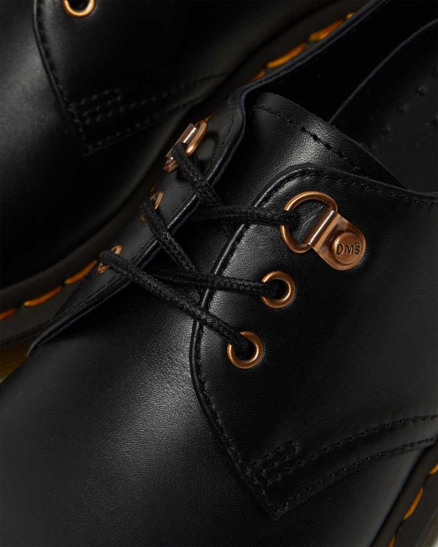 schwarze dr. martens 1461 damen-freizeitschuhe mit roségoldenen beschlägen