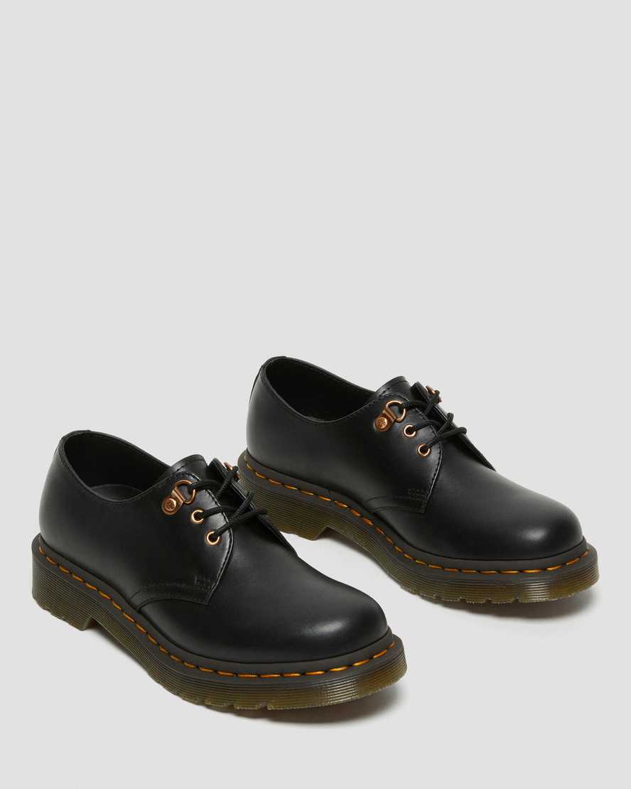 schwarze dr. martens 1461 damen-freizeitschuhe mit roségoldenen beschlägen