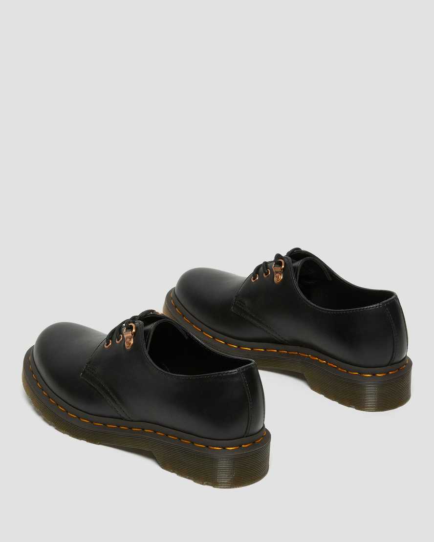 schwarze dr. martens 1461 damen-freizeitschuhe mit roségoldenen beschlägen