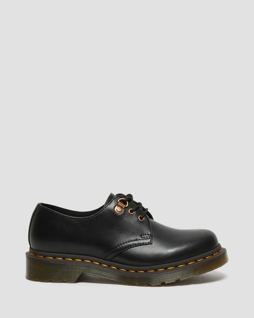schwarze dr. martens 1461 damen-freizeitschuhe mit roségoldenen beschlägen
