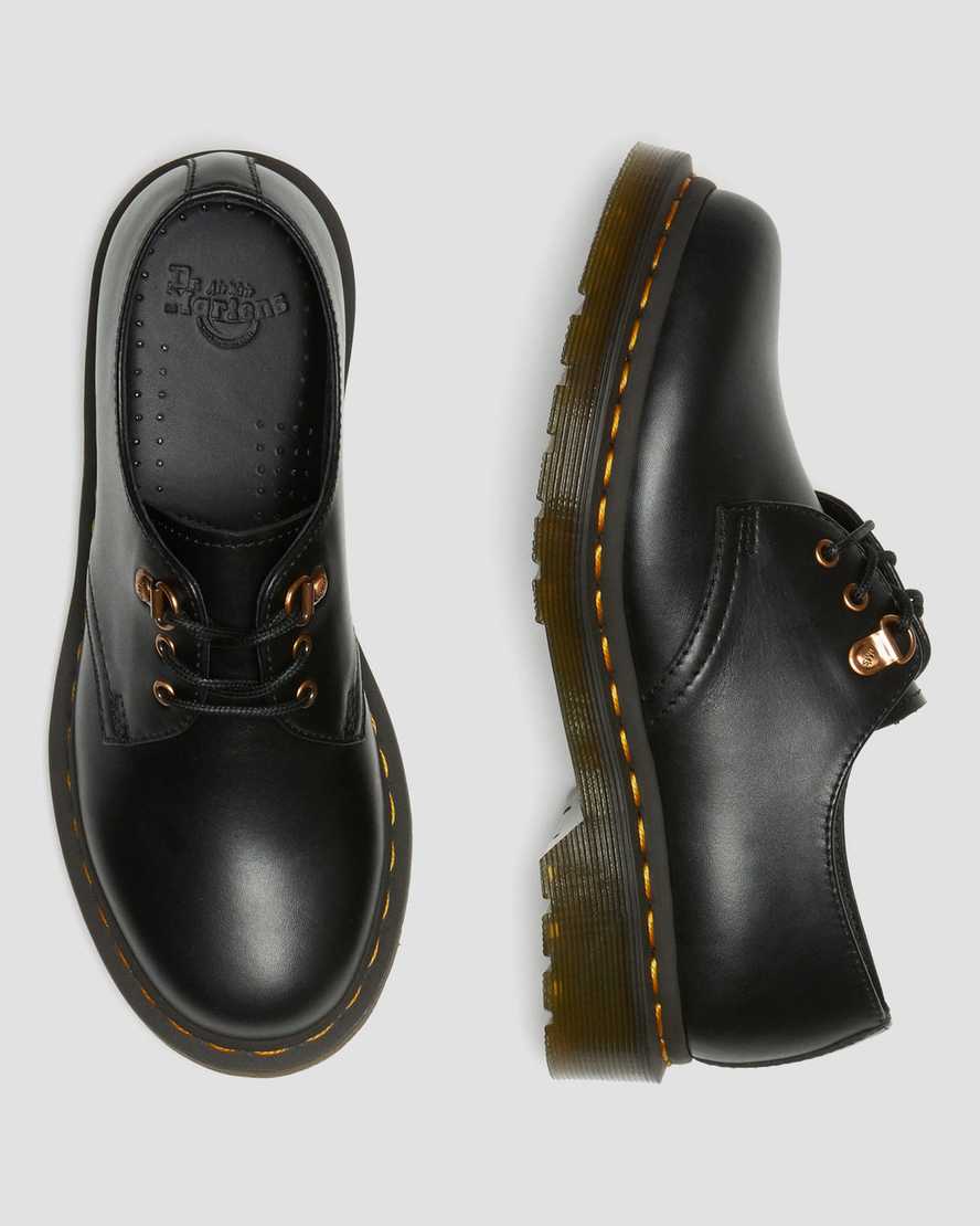 schwarze dr. martens 1461 damen-freizeitschuhe mit roségoldenen beschlägen