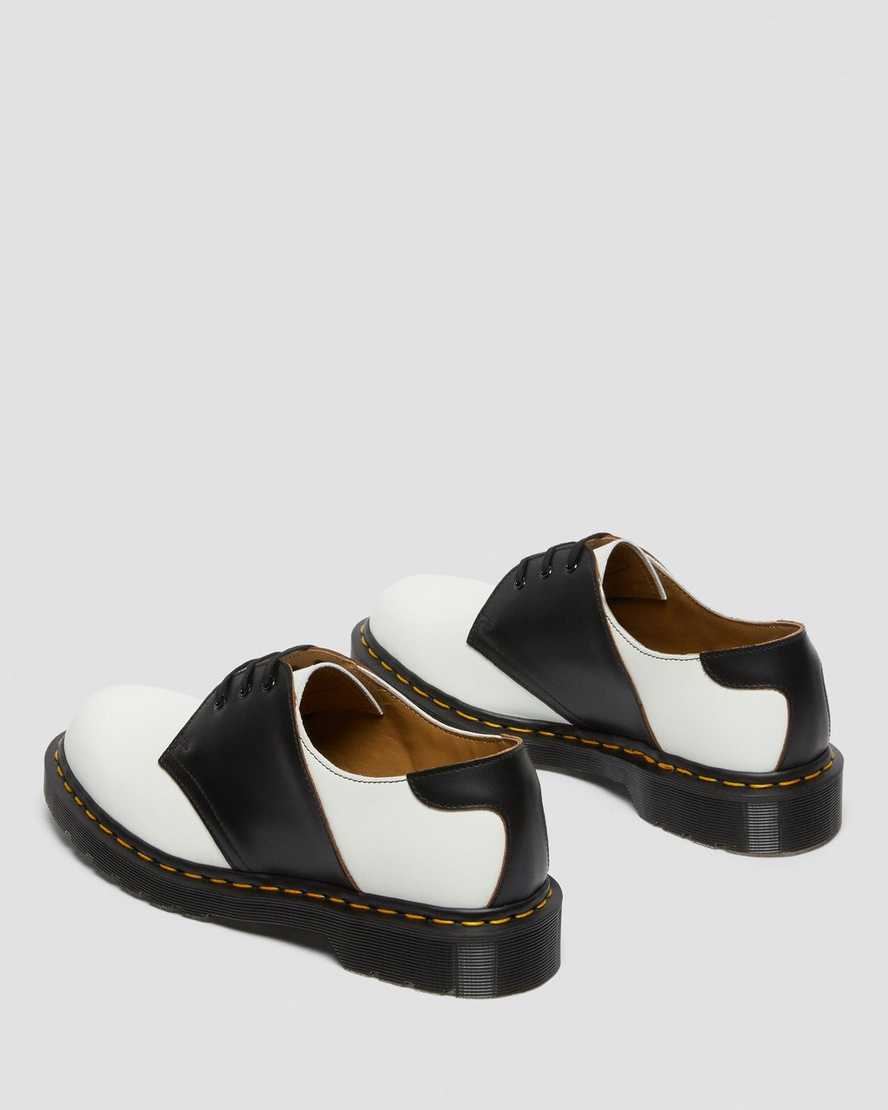 weiße und schwarze dr. martens 1461 damen-sattelschuhe